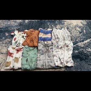 Boys Sleepers 8 of them, sizes 0-3 moths to 12 months.